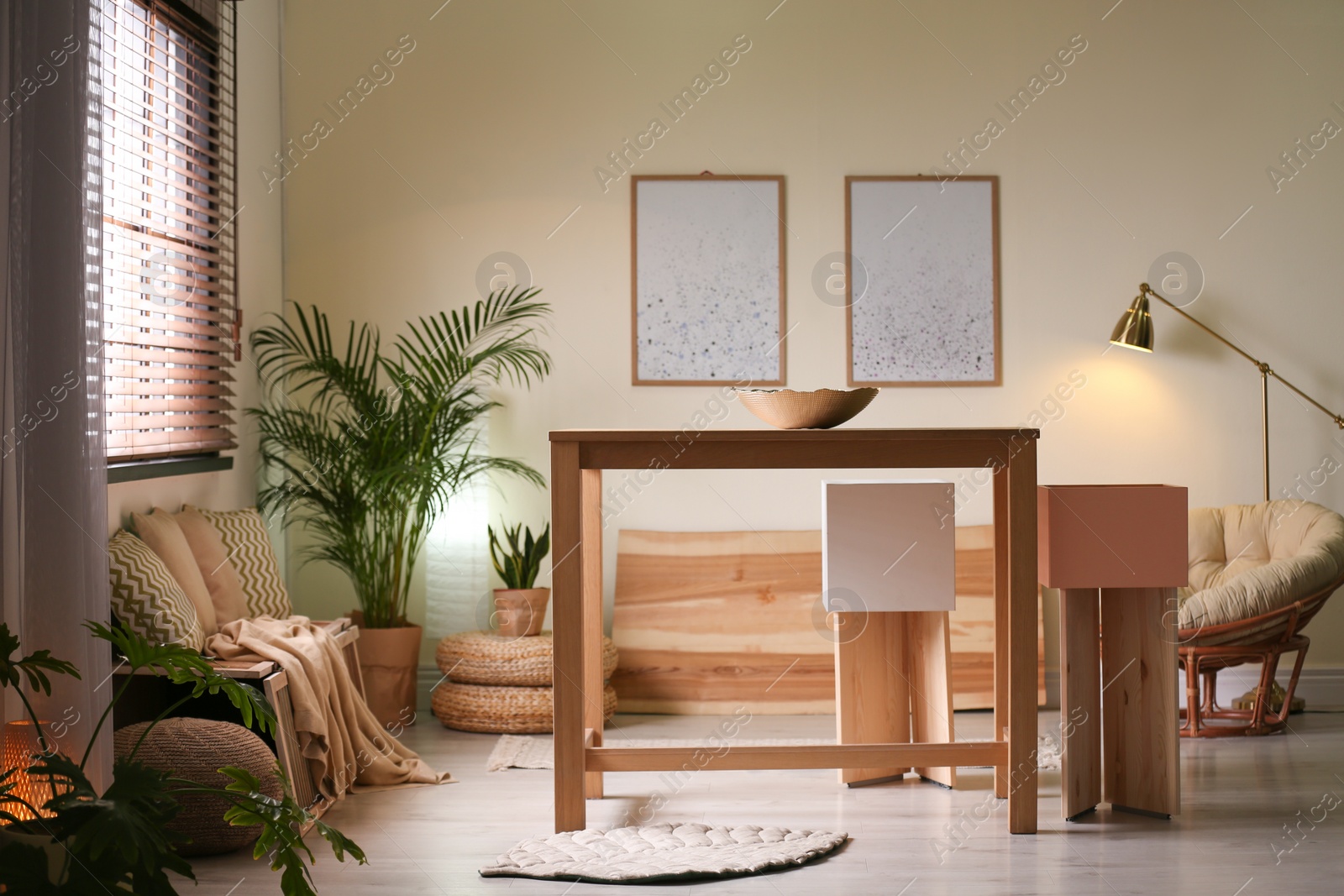 Photo of Stylish dining room interior with modern table set and window blinds