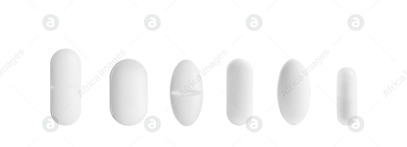 Image of Set of different pills in row isolated on white