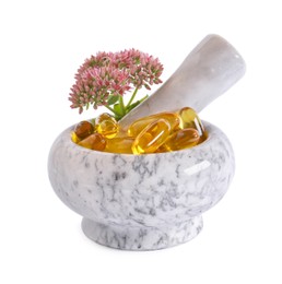 Mortar with flowers and pills on white background