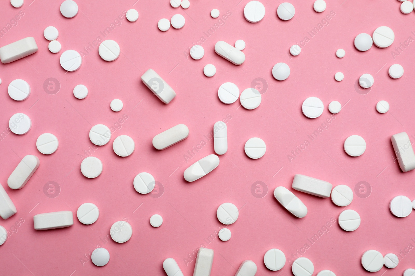 Photo of Different pills and capsules on color background, flat lay