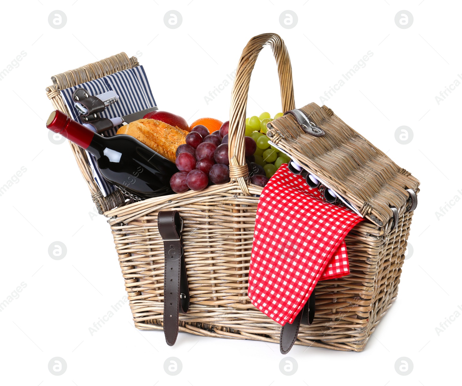 Photo of Wicker picnic basket with wine and different products on white background