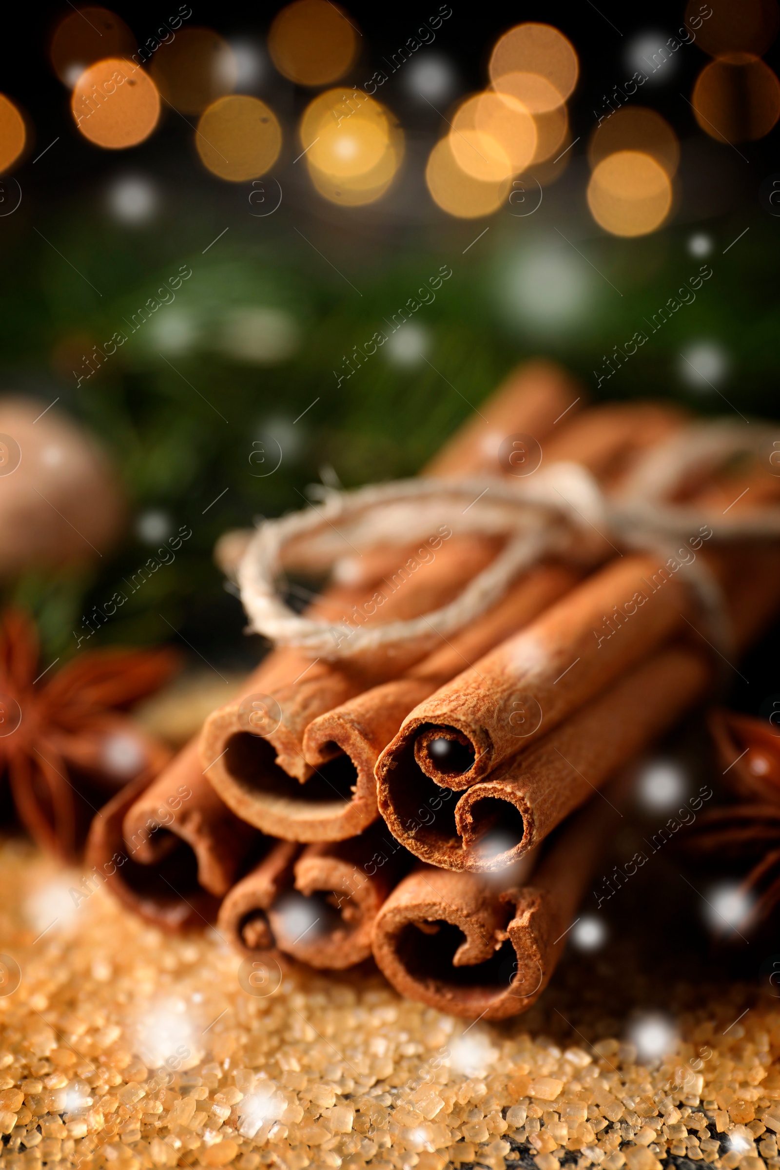 Image of Different spices, closeup. Cinnamon, anise on brown sugar. Bokeh effect