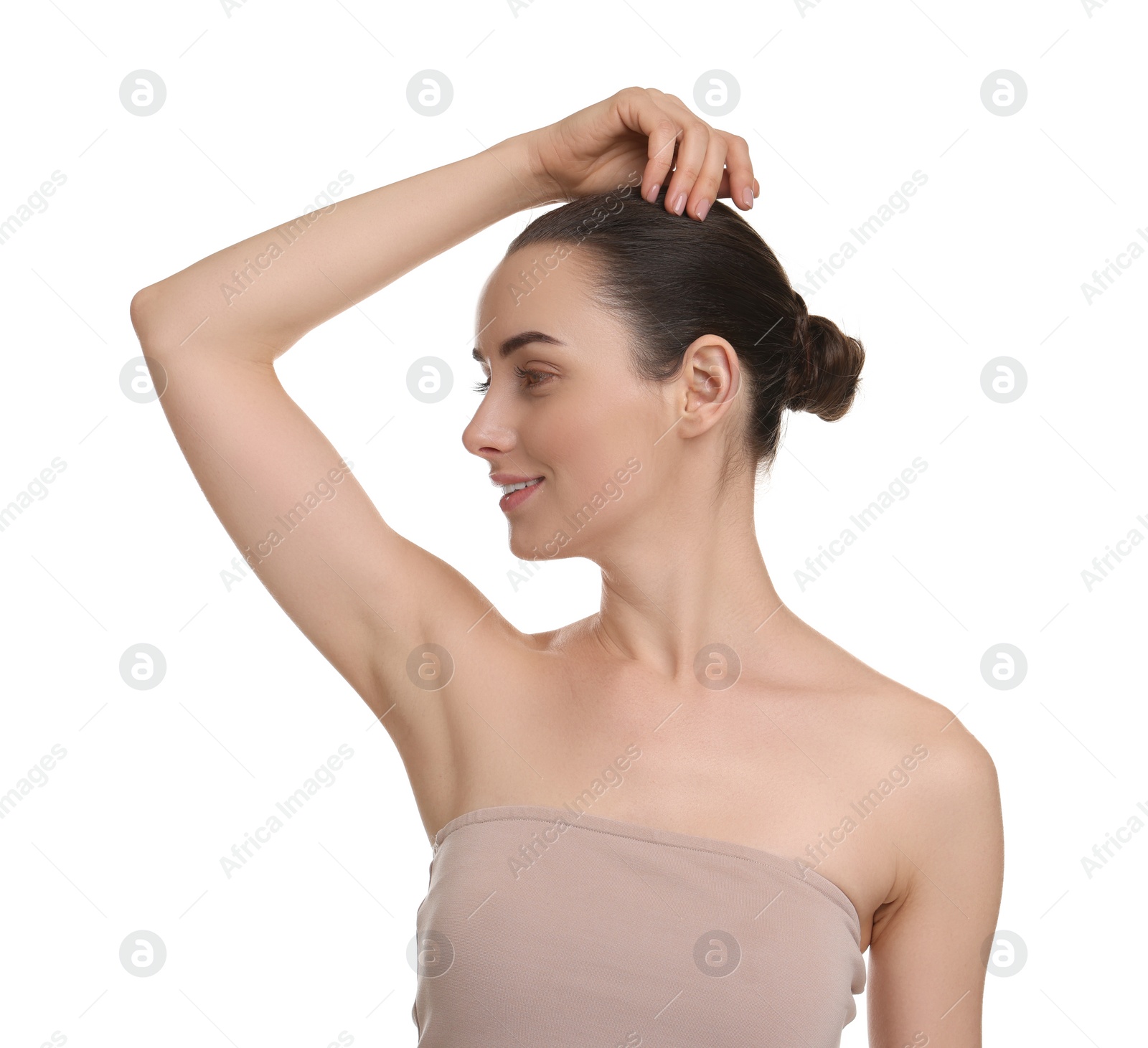 Photo of Beautiful woman showing armpit with smooth clean skin on white background