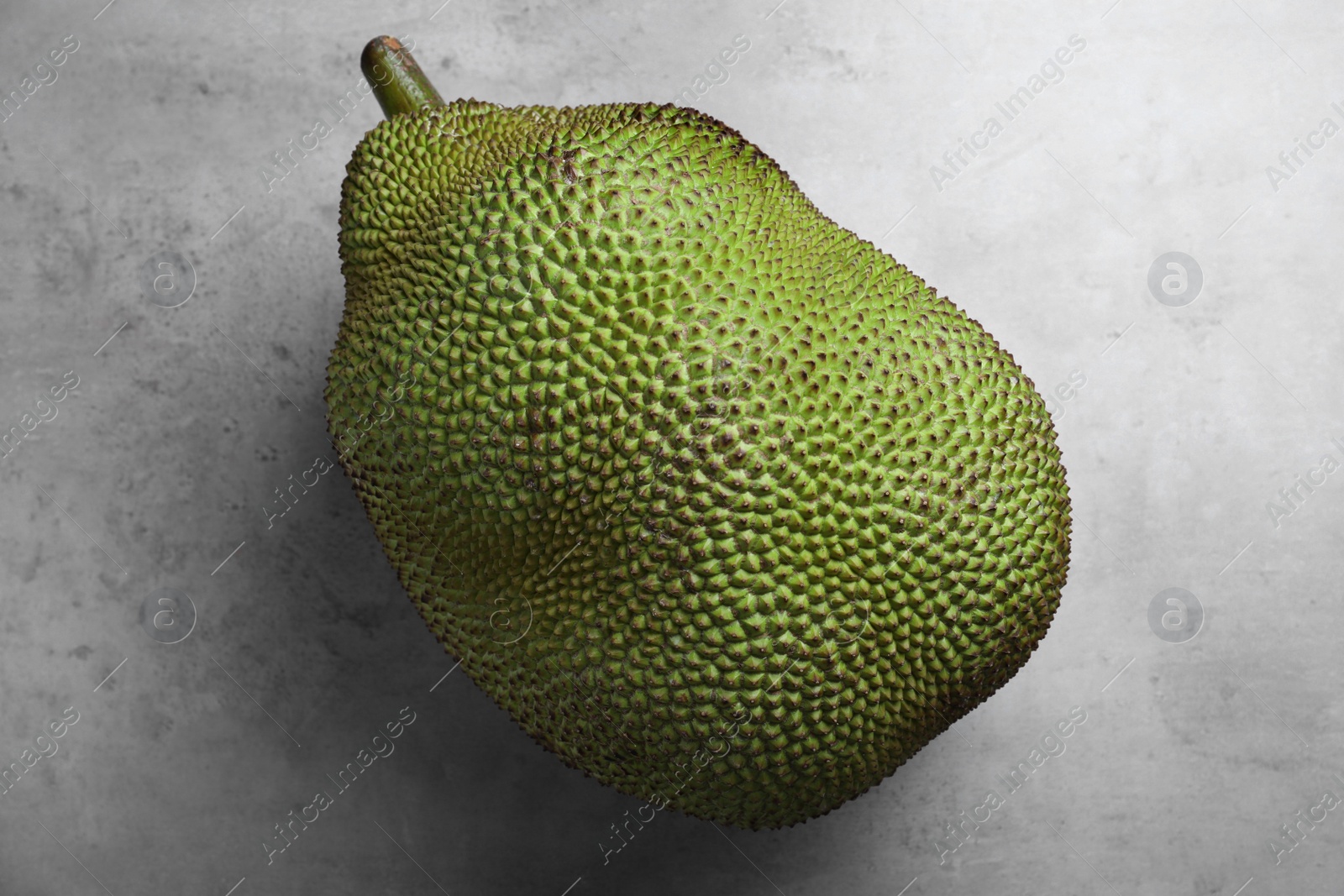 Photo of Delicious exotic jackfruit on light grey table, top view