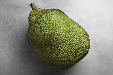 Delicious exotic jackfruit on light grey table, top view