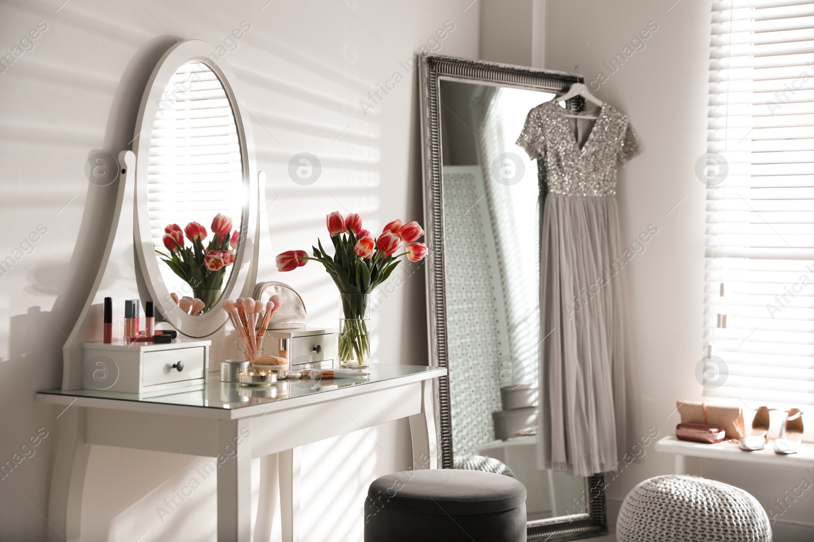 Photo of Stylish room interior with elegant dressing table and mirror