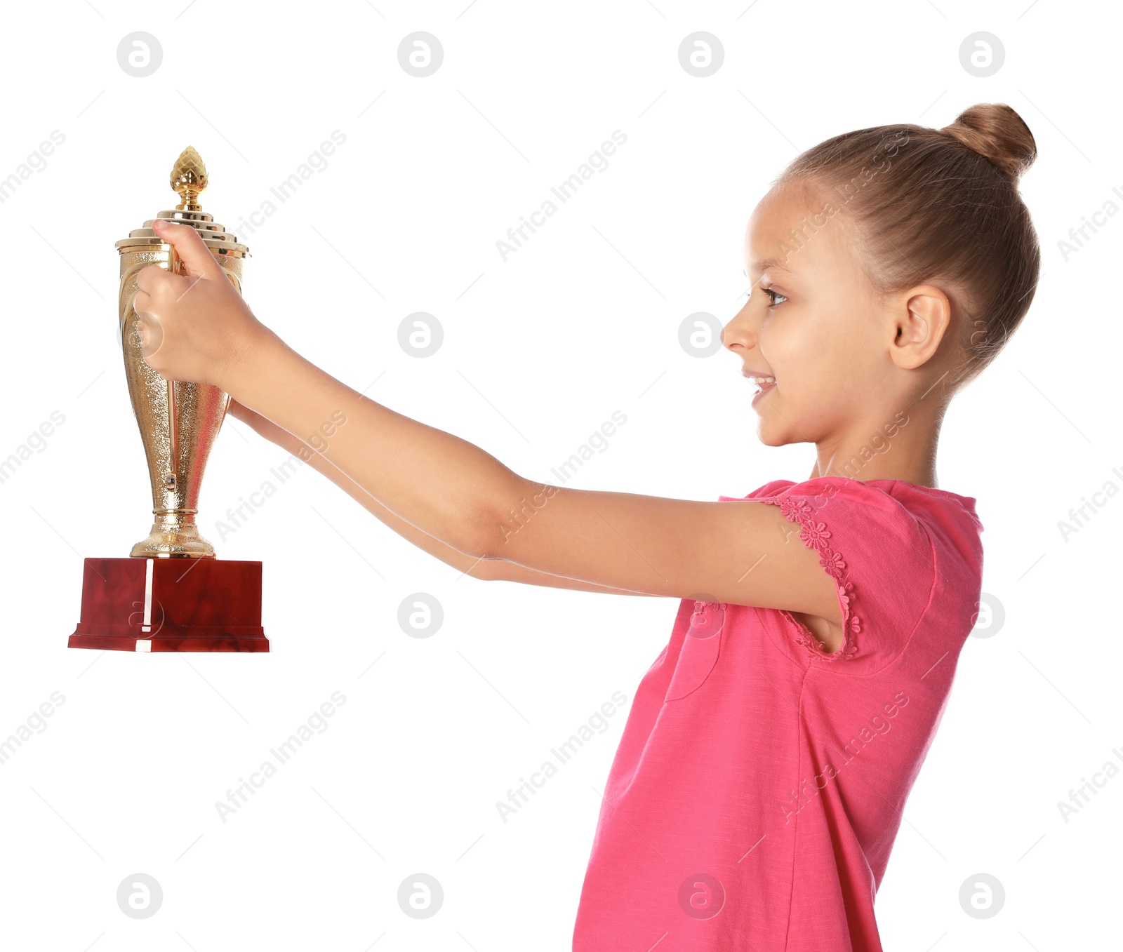 Photo of Happy girl with golden winning cup on white background