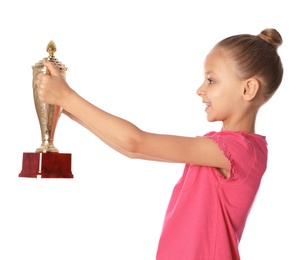 Photo of Happy girl with golden winning cup on white background