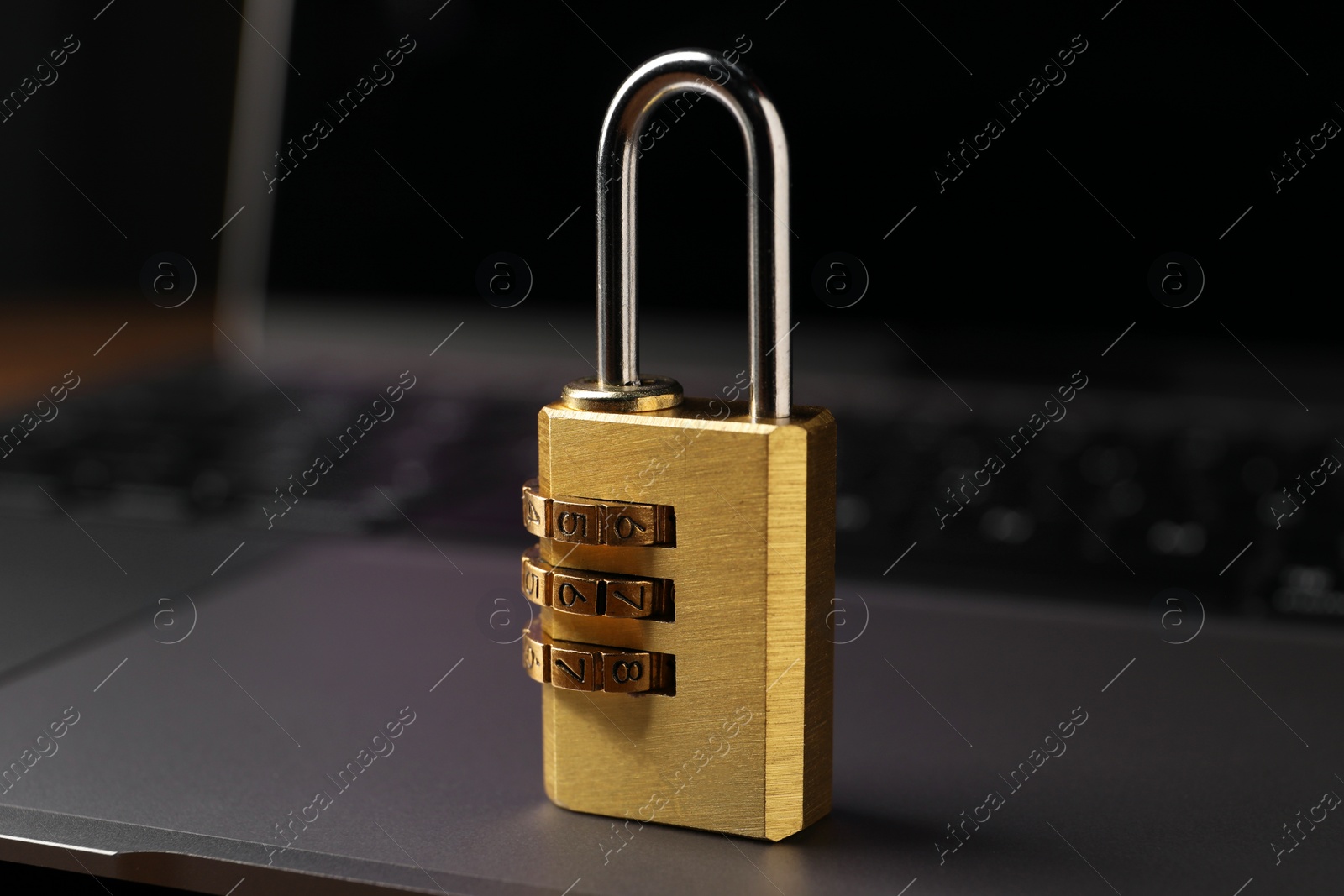 Photo of Cyber security. Padlock on laptop, closeup view