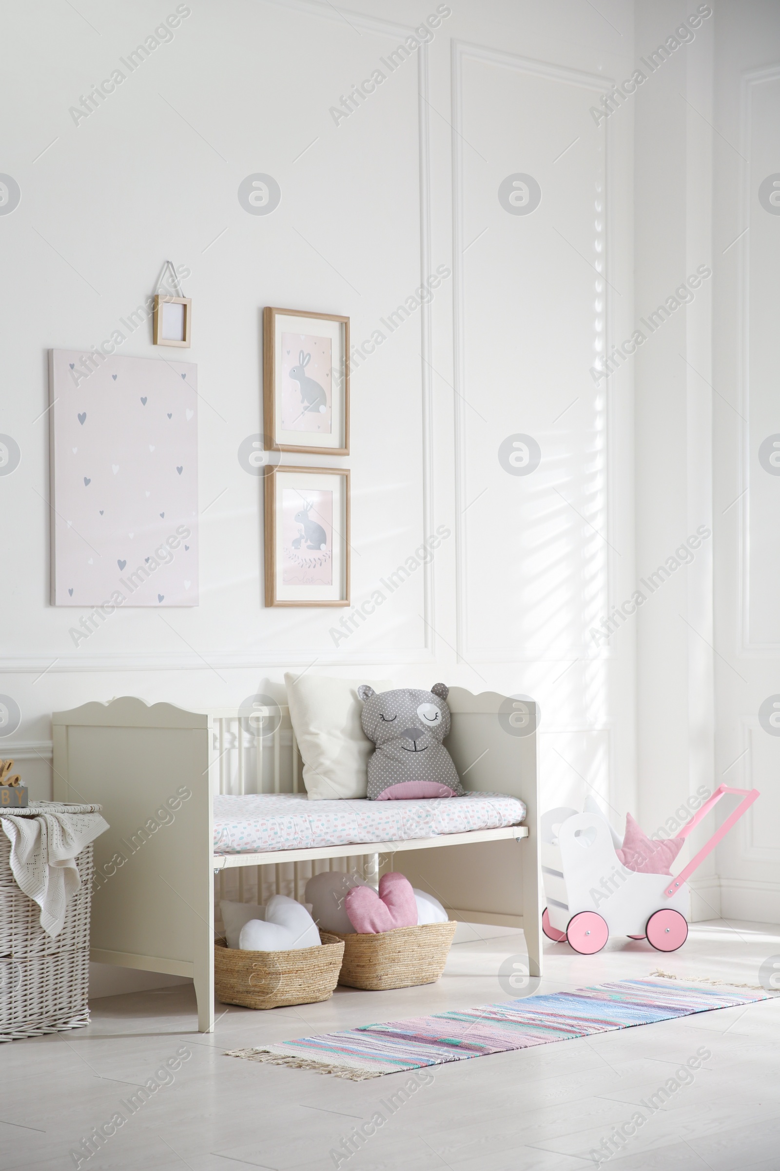 Photo of Baby room interior with stylish furniture and toys