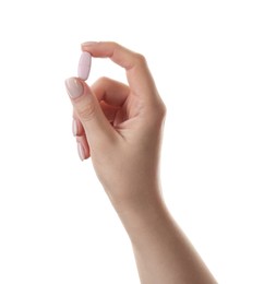 Photo of Woman holding vitamin pill on white background, closeup. Health supplement