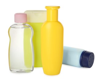 Bottles of baby cosmetic products on white background