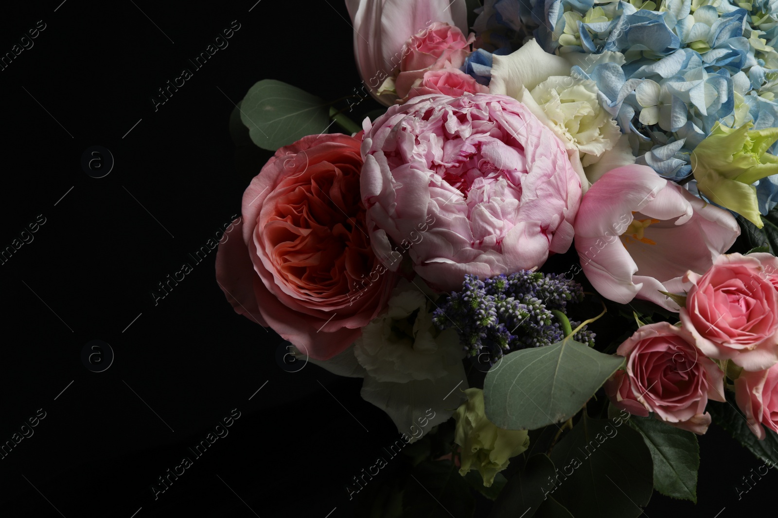 Photo of Beautiful bouquet of fresh flowers on dark background