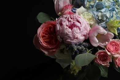 Beautiful bouquet of fresh flowers on dark background