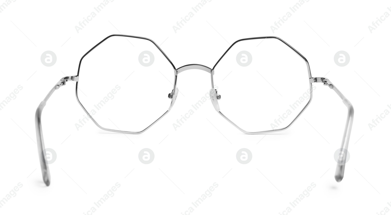 Photo of Stylish glasses with metal frame isolated on white