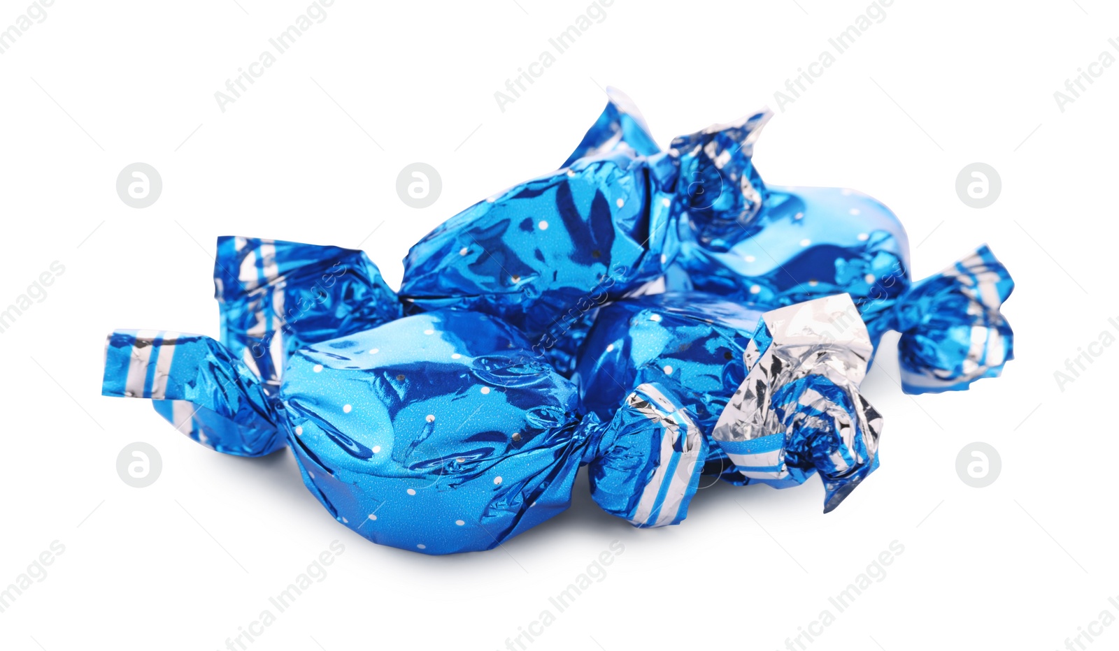 Photo of Candies in light blue wrappers isolated on white
