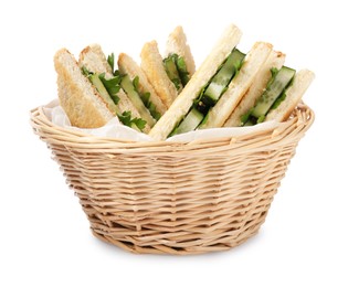 Tasty sandwiches with cucumber and parsley in wicker basket on white background