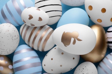 Beautifully painted Easter eggs as background, top view