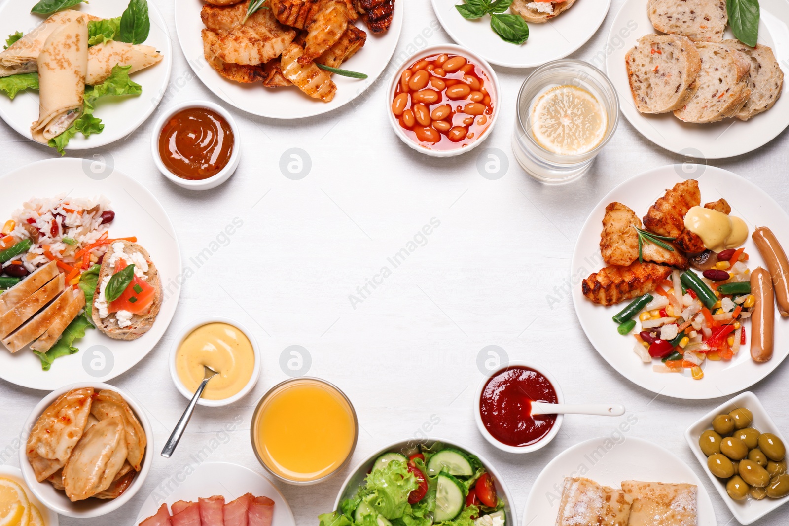 Photo of Buffet service. Frame of different dishes on white wooden table, space for text