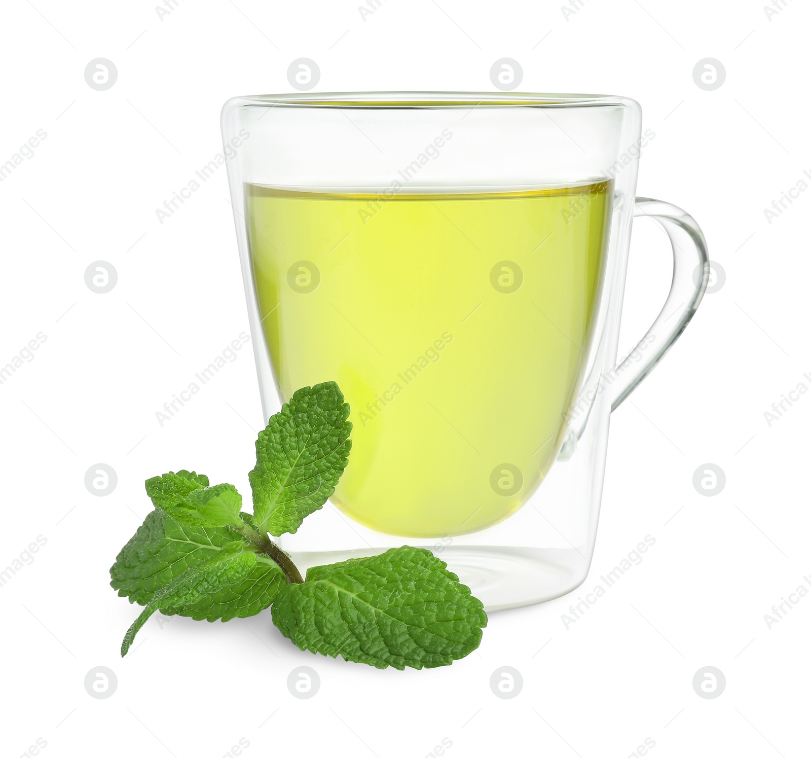 Photo of Fresh green tea in glass mug and mint isolated on white