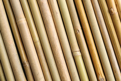 Photo of Dry bamboo sticks as background, top view