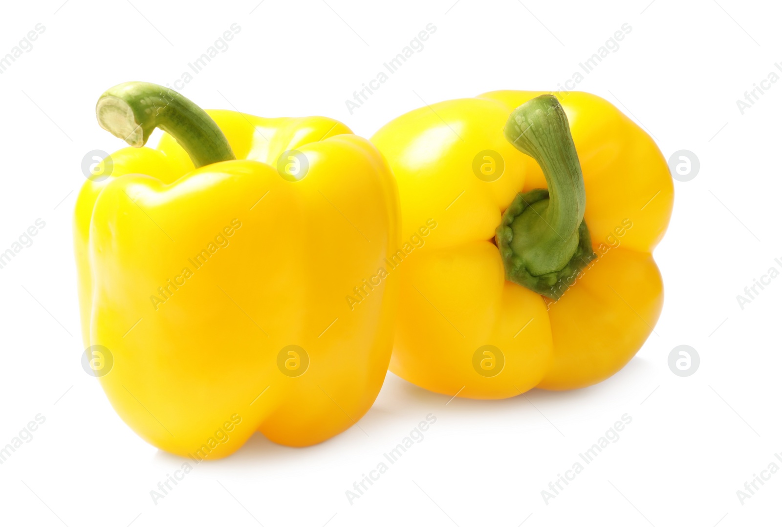 Photo of Ripe yellow bell peppers isolated on white