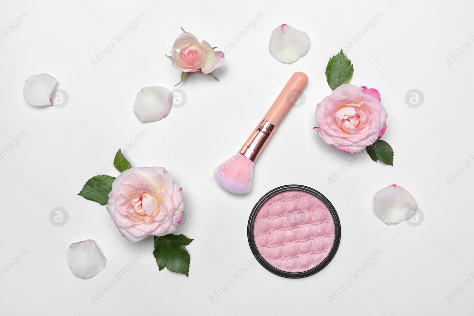 Photo of Flat lay composition with makeup brush, powder and flowers on white background