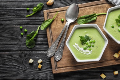 Photo of Fresh vegetable detox soup made of green peas served on table, top view. Space for text