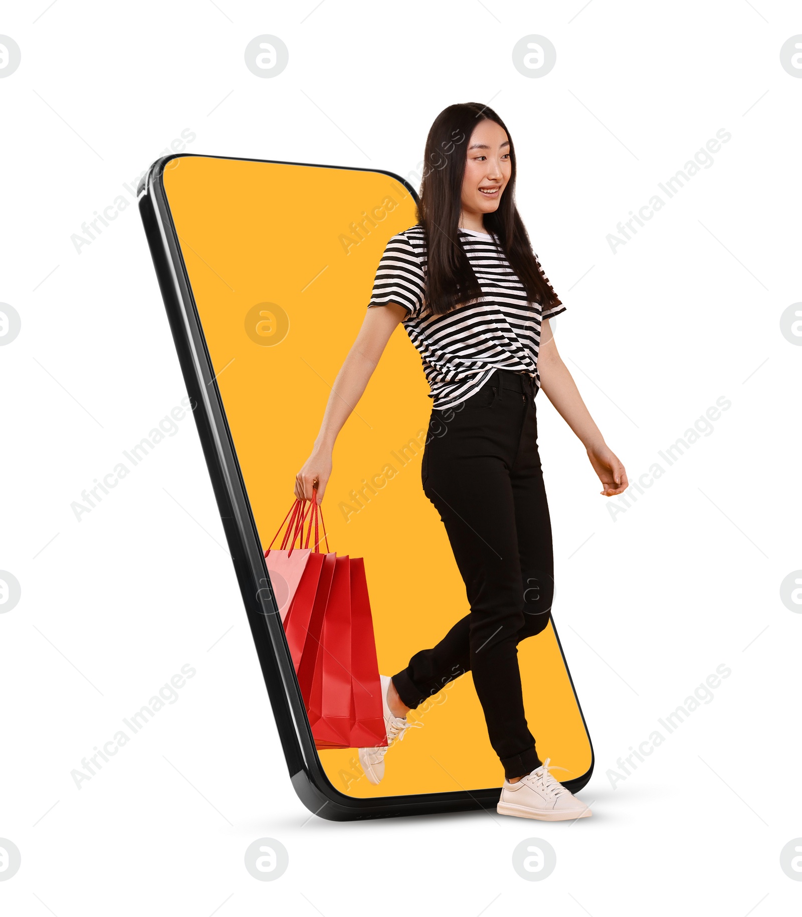 Image of Online shopping. Happy woman with paper bags walking out from smartphone on white background