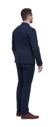 Businessman in suit standing on white background