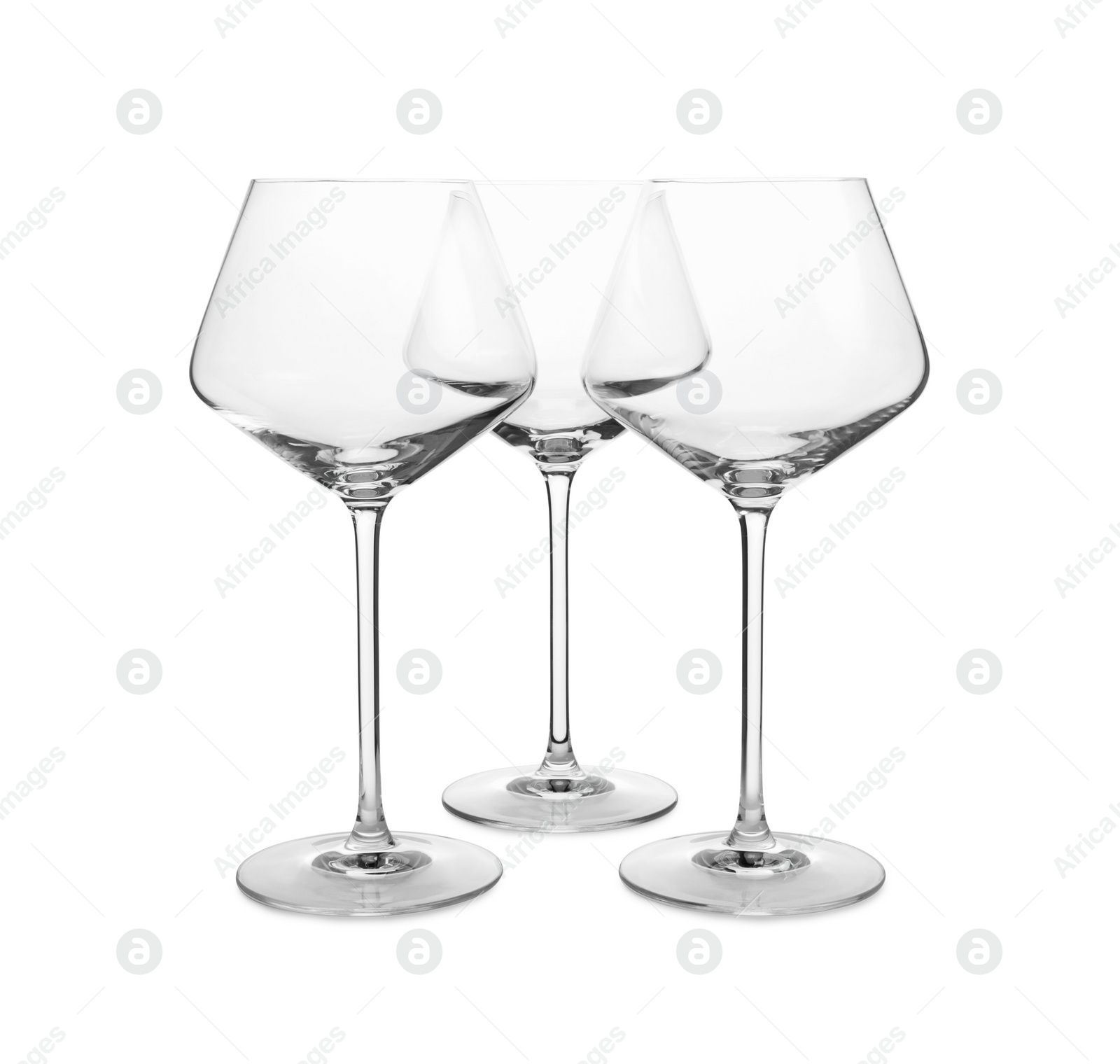 Photo of Elegant clean empty wine glasses isolated on white