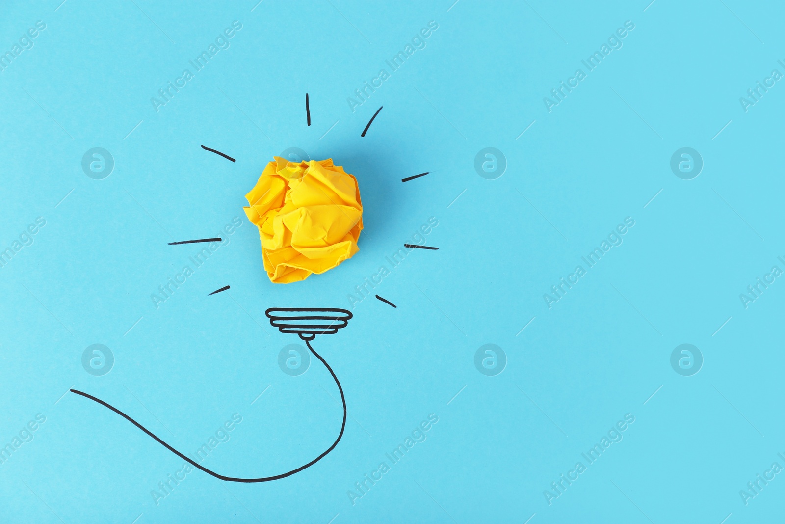 Photo of Composition with crumpled paper ball, drawing of lamp bulb and space for text on color background, top view. Creative concept