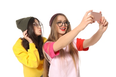 Photo of Attractive young women taking selfie on white background