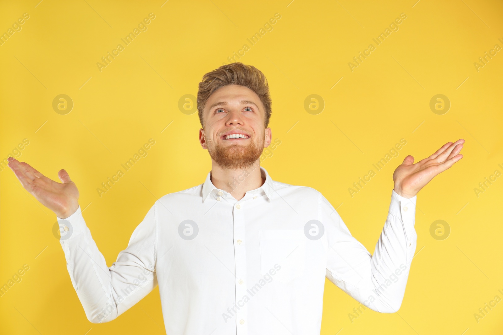 Photo of Portrait of handsome emotional man on color background
