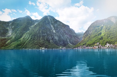 Picturesque view of small resort town near mountains on riverside