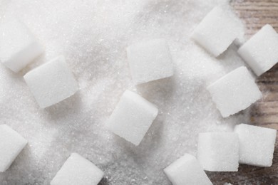 Photo of Different types of white sugar on table, top view