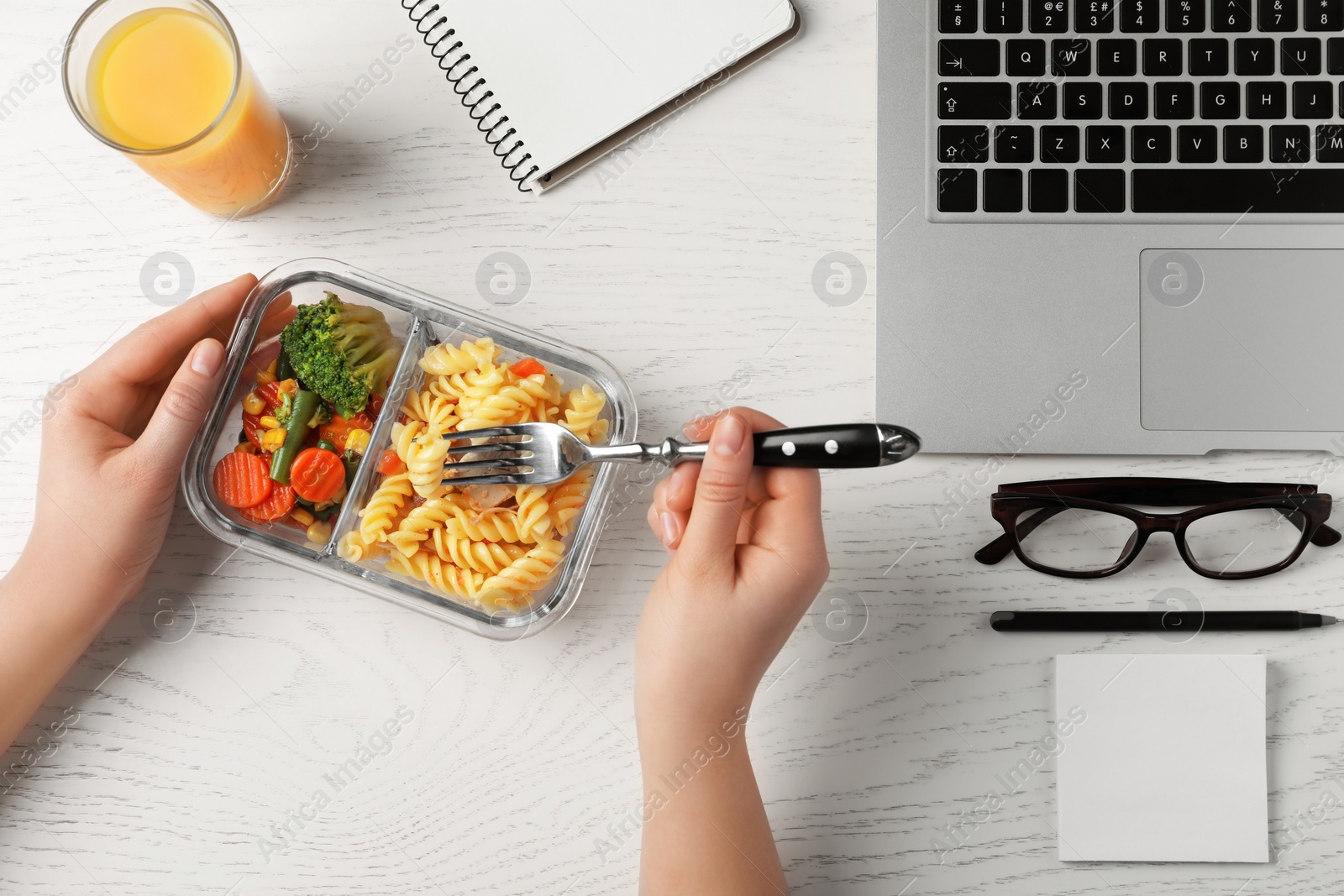 Photo of Office employee having business lunch at workplace, top view