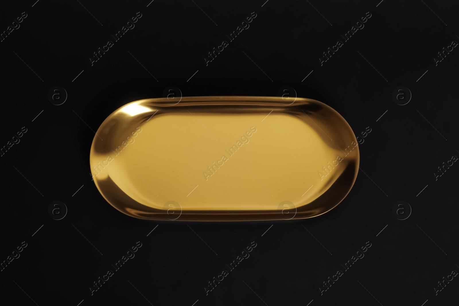 Photo of Luxury gold metal tray on black background, top view