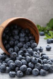 Tasty fresh blueberries on wooden table, closeup