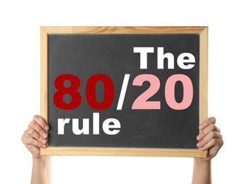 Image of Pareto principle concept. Woman holding blackboard with 80/20 rule representation on white background, closeup
