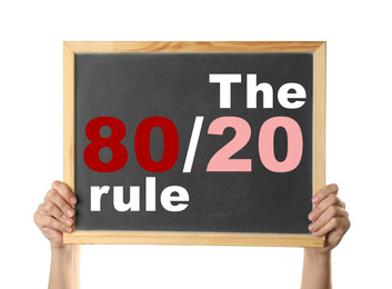 Pareto principle concept. Woman holding blackboard with 80/20 rule representation on white background, closeup