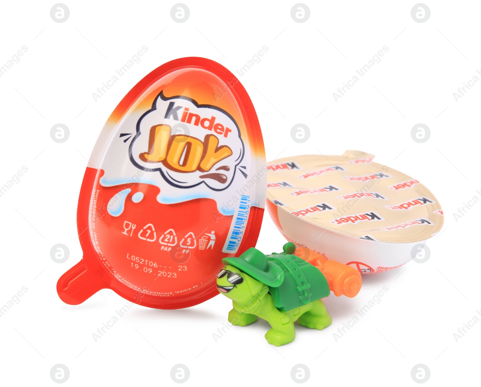 Photo of Slynchev Bryag, Bulgaria - May 24, 2023: Kinder Joy Egg and toy turtle isolated on white