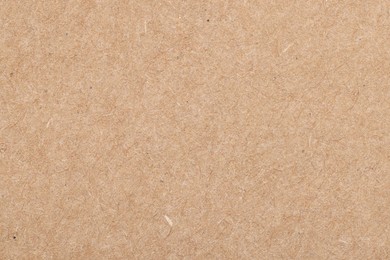 Photo of Texture of beige paper sheet as background, top view