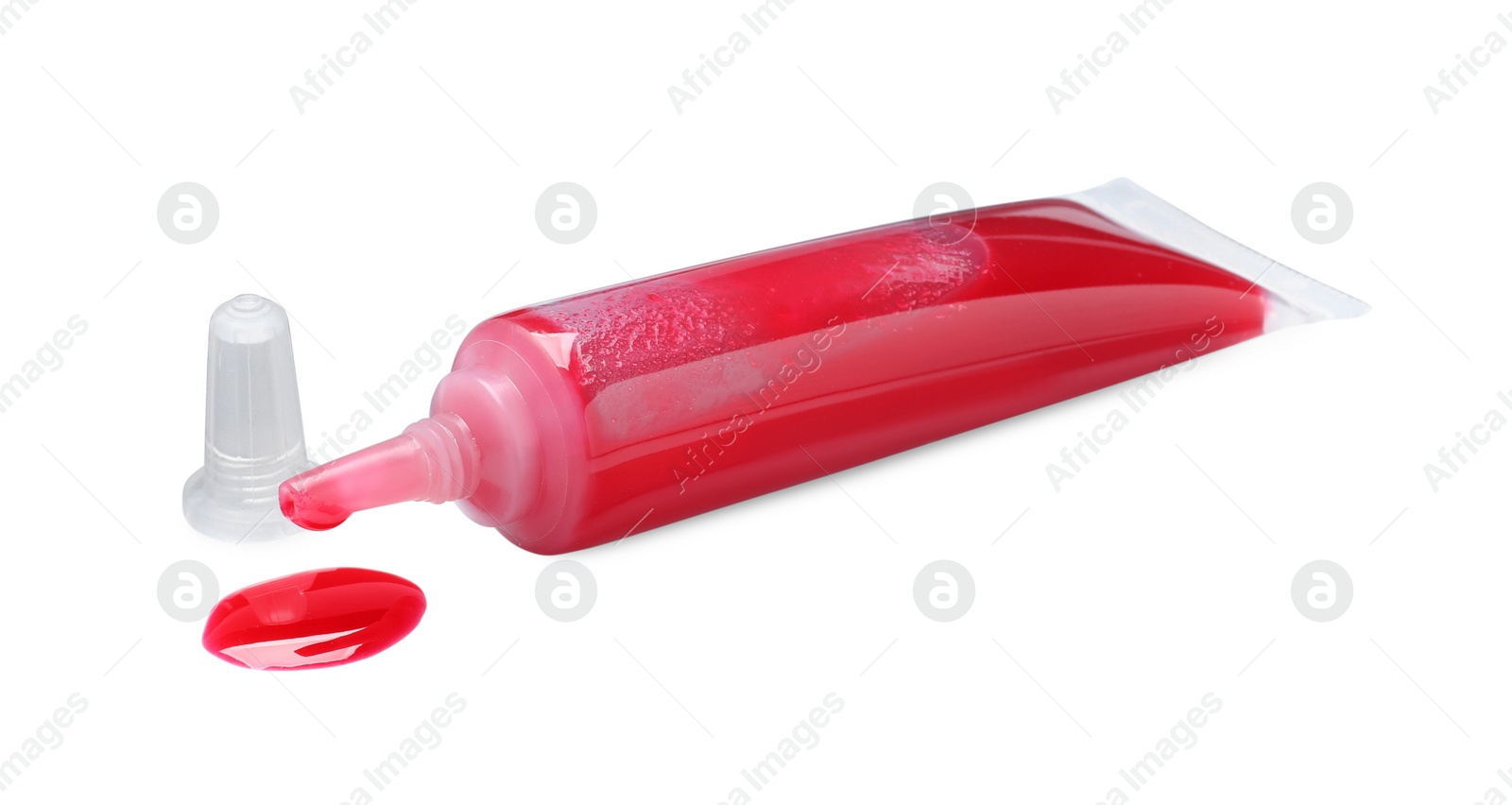 Photo of Tube with red food coloring isolated on white