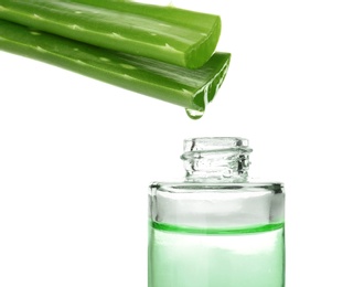 Aloe vera juice dripping from plant into bottle