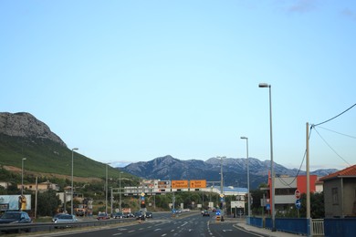 Trogir, Croatia - September 24, 2023: Picturesque view of highway with cars and mountains