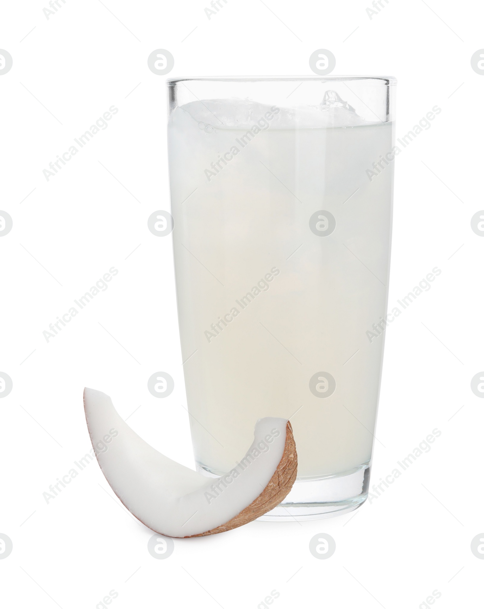 Photo of Glass of coconut water, ice cubes and nut isolated on white