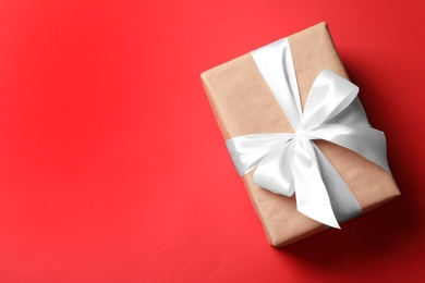 Photo of Beautiful gift box on color background, top view