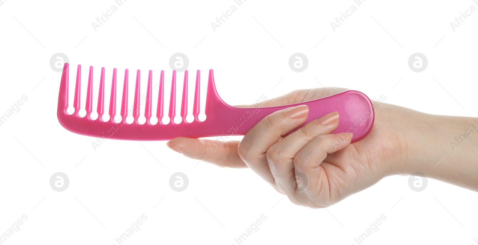 Photo of Woman holding hair comb on white background, closeup