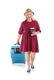 Photo of Senior woman with suitcase and passport on white background. Vacation travel